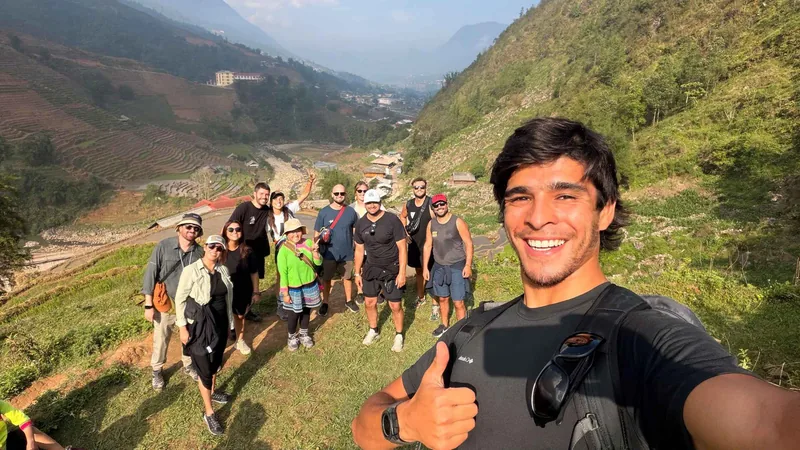A trekking group on a hillside above Sapa town on a 3-day Vietnam tour package with a homestay, Sapa, Vietnam