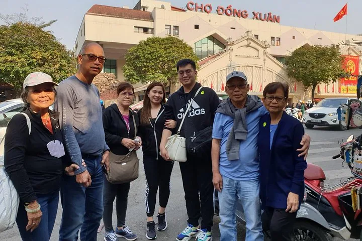 Travelers gathered outside Dong Xuan Market on a 7-day Vietnam tour package from Hanoi to Da Nang, Hanoi, Vietnam