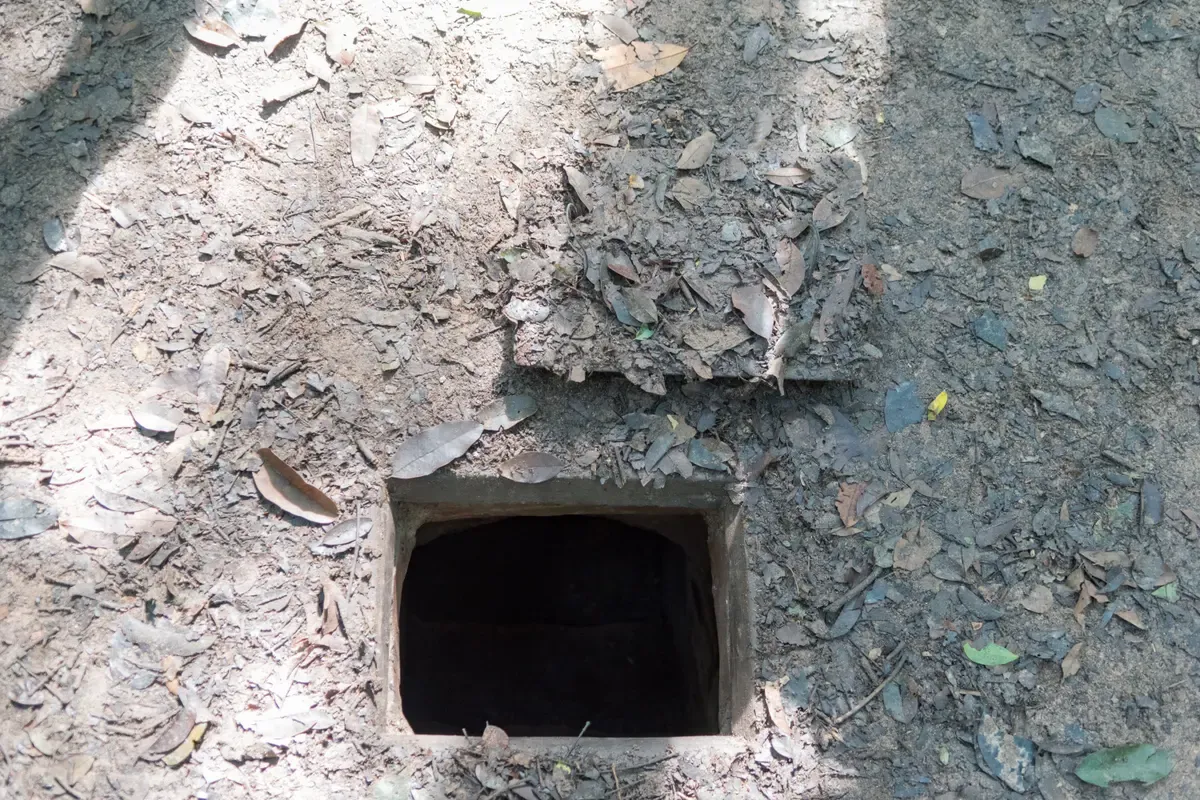 A tunnel entrance at Cu Chi on a 9-Day Vietnam Tour
